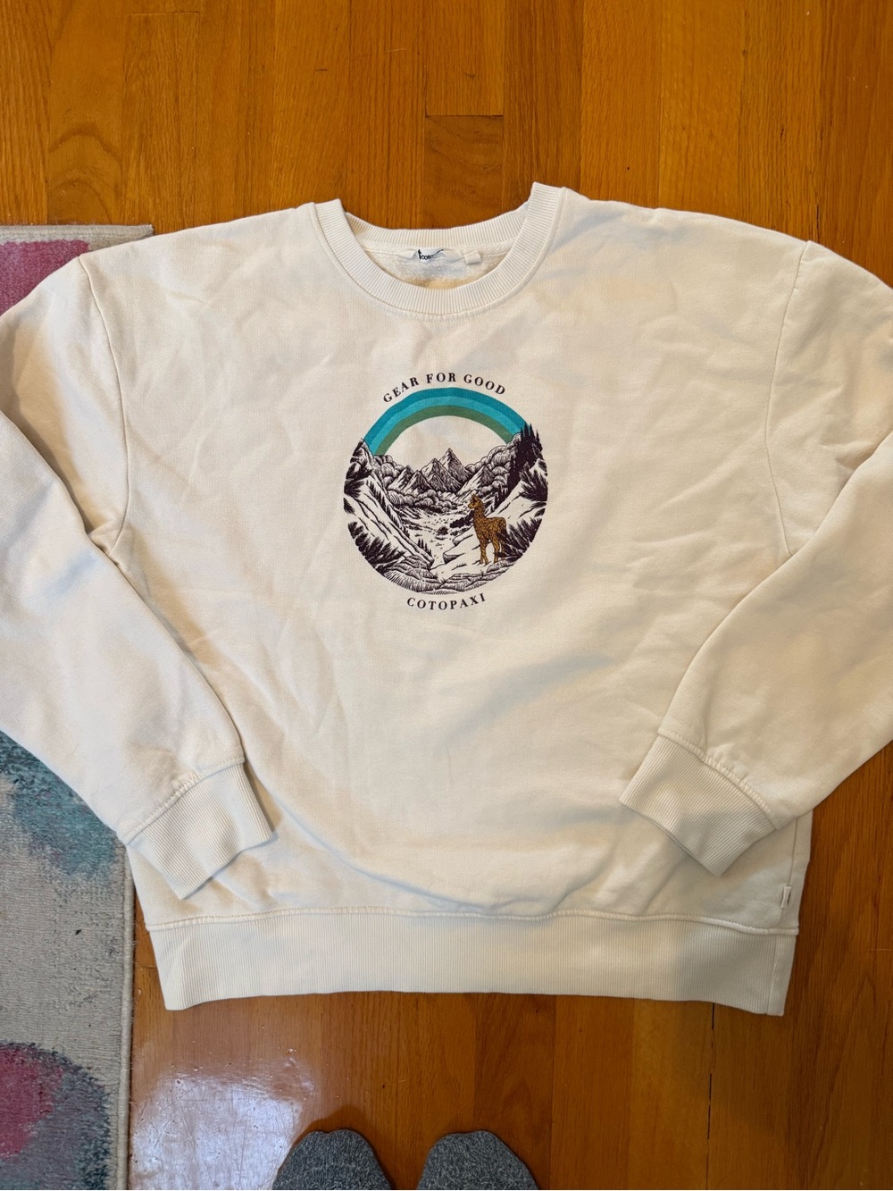 cotopaxi Cream Crewneck Sweatshirt with Teal Arch Graphic